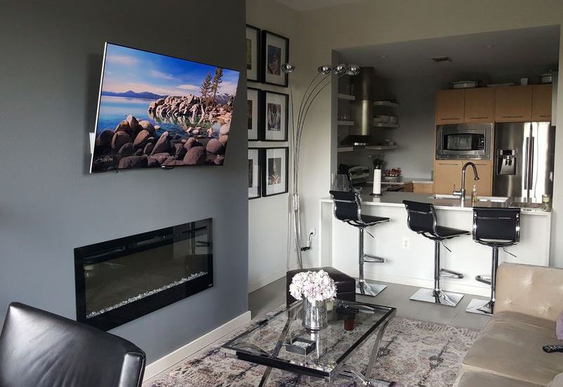 Living Room With TV On Wall Above Fireplace_8_135712